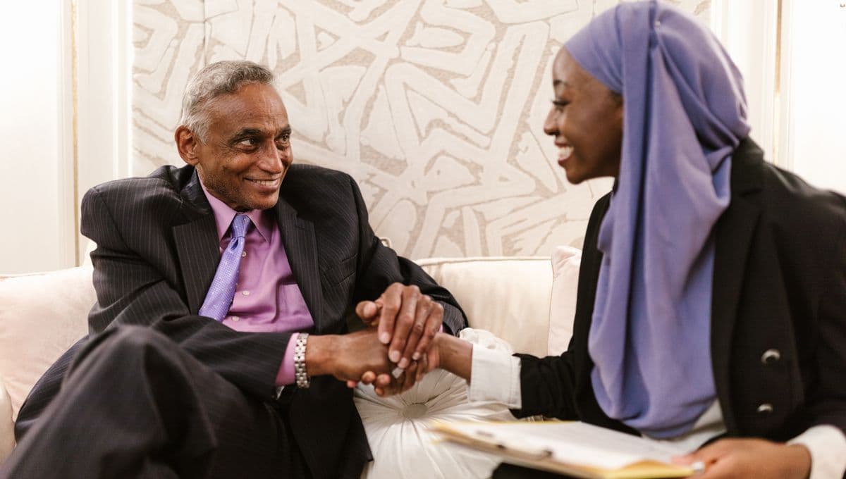 Two professionals shaking hands to seal a business deal